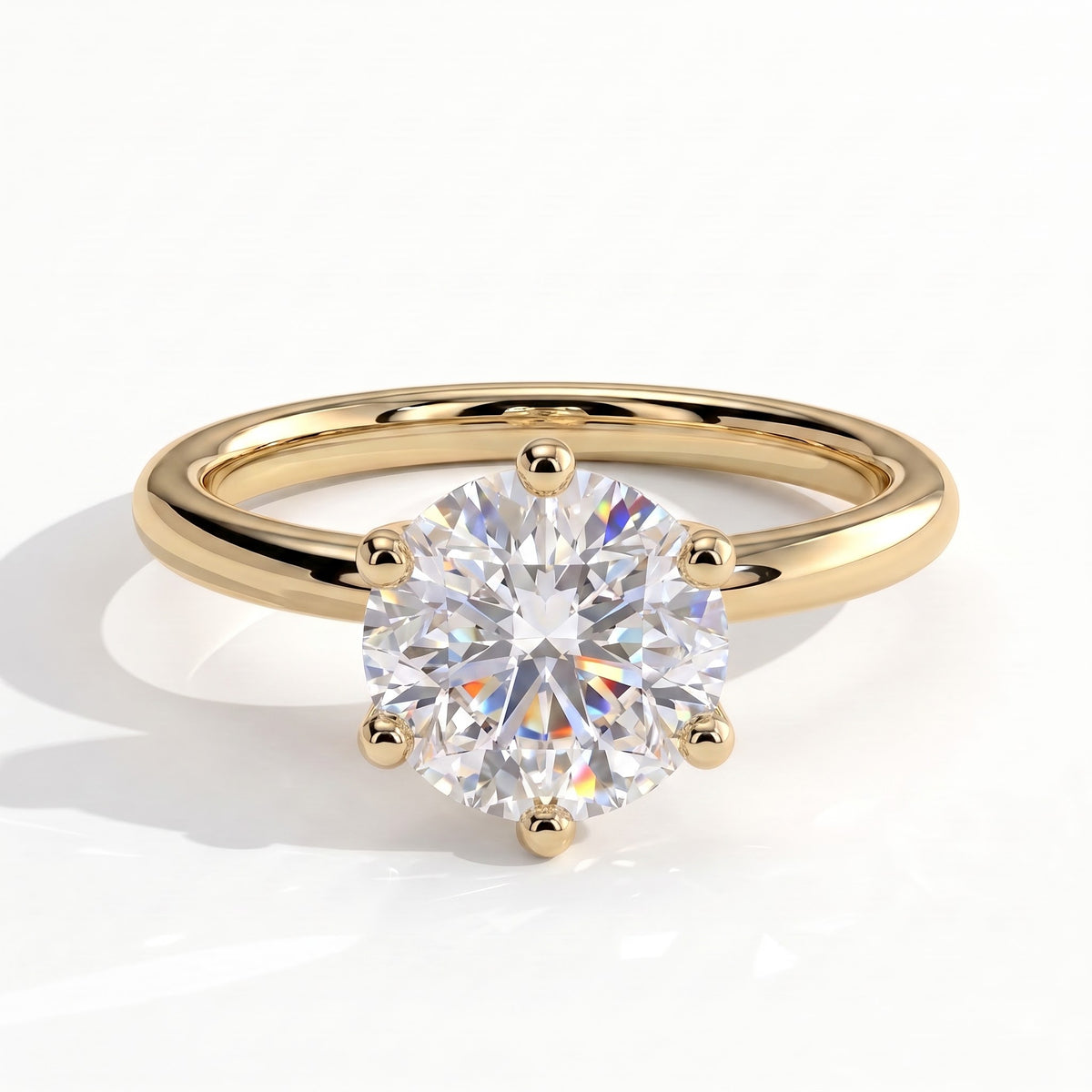 Round lab-grown diamond solitaire engagement ring in 14K (585) yellow gold, front view 