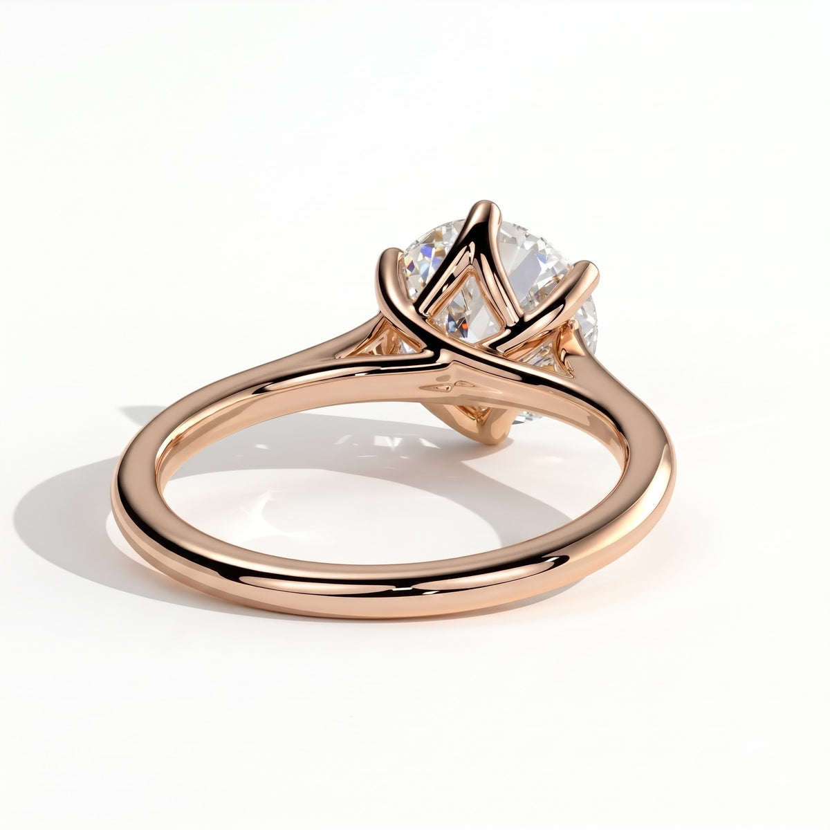 Round lab-grown diamond solitaire engagement ring in 14K (585) rose gold, on white background 