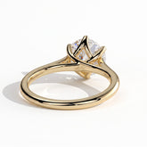 Round lab-grown diamond solitaire engagement ring in 18K (750) yellow gold, on white background 