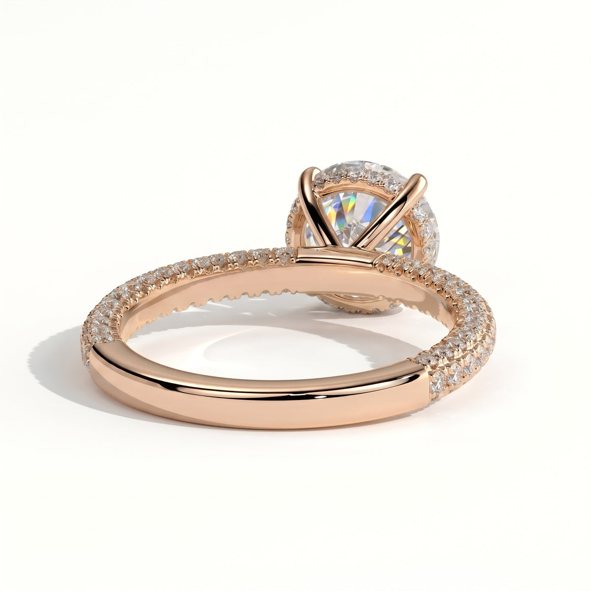 Round lab-grown diamond halo engagement ring in 14K (585) rose gold, on white background 