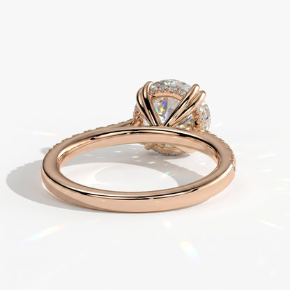 Round lab-grown diamond halo engagement ring in 14K (585) rose gold, on white background 