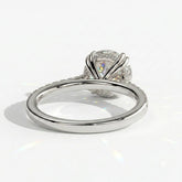 Round lab-grown diamond halo engagement ring in 18K (750) white gold, on white background 