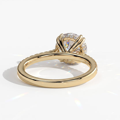 Round lab-grown diamond halo engagement ring in 18K (750) yellow gold, on white background 