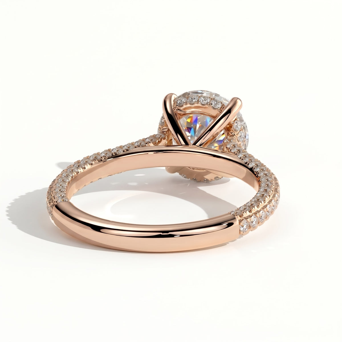 Round lab-grown diamond halo engagement ring in 18K (750) rose gold, on white background 