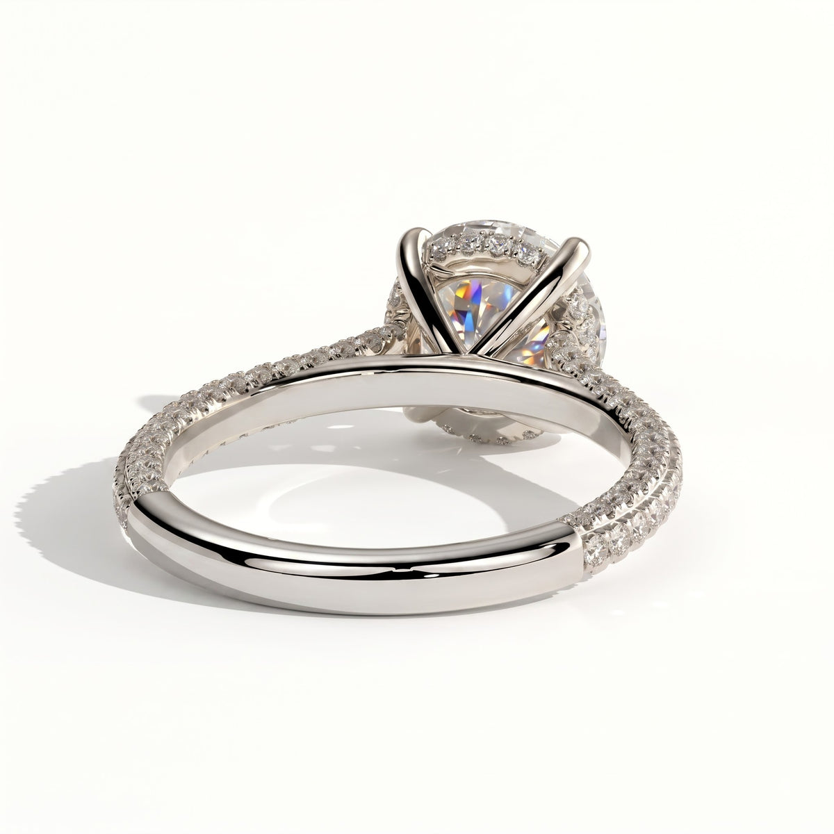 Round lab-grown diamond halo engagement ring in 18K (750) white gold, on white background 