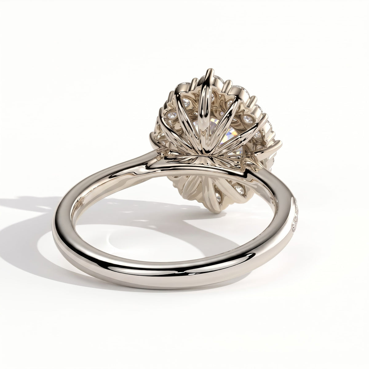 Round lab-grown diamond halo engagement ring in 14K (585) white gold, on white background 