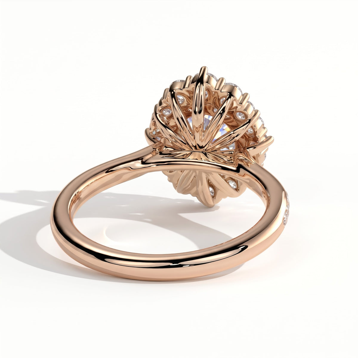 Round lab-grown diamond halo engagement ring in 14K (585) rose gold, on white background 