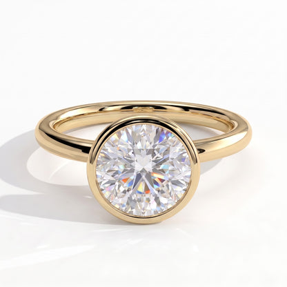 Round lab-grown diamond bezel-set solitaire engagement ring in 14K (585) yellow gold, front view 
