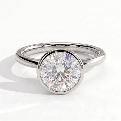 Round lab-grown diamond bezel-set solitaire engagement ring in 14K (585) white gold, front view 