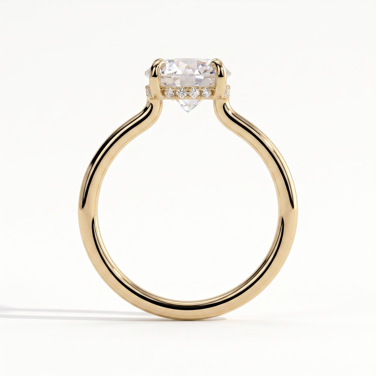 Round lab-grown diamond solitaire engagement ring in 14K (585) yellow gold, side profile 