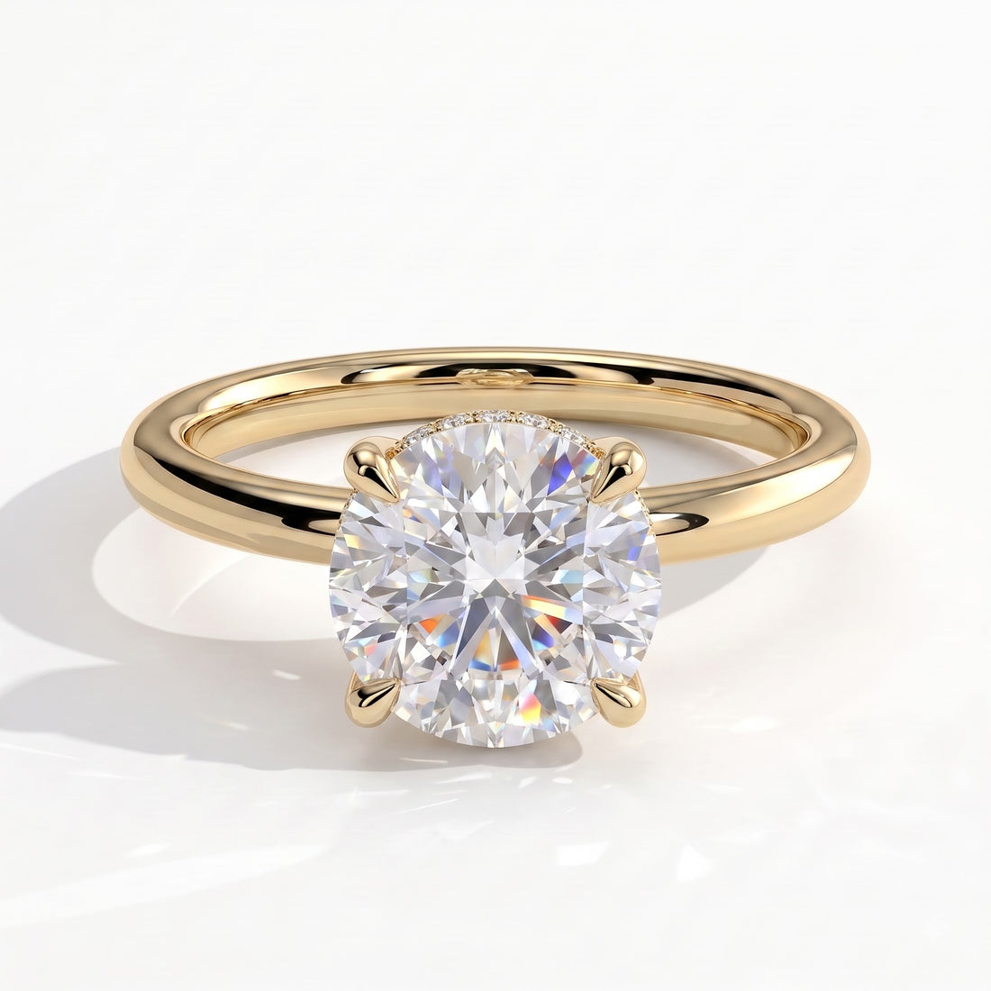 Round lab-grown diamond solitaire engagement ring in 14K (585) yellow gold, front view 