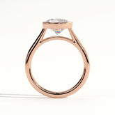 Round lab-grown diamond bezel-set solitaire engagement ring in 18K (750) rose gold, side profile 