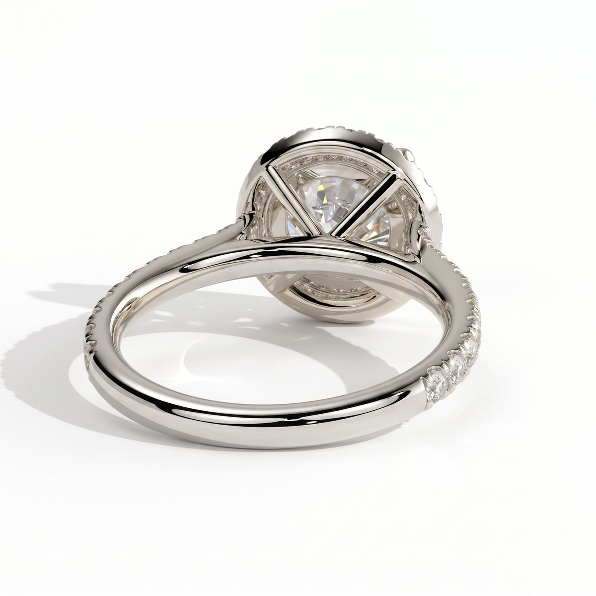 Round lab-grown diamond halo engagement ring in 950 platinum, on white background 