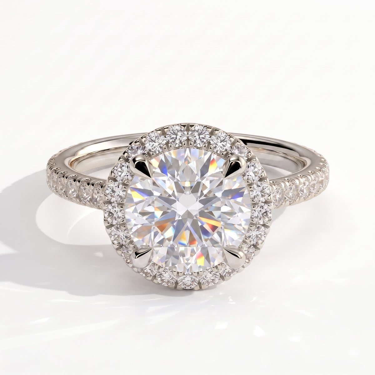 Round lab-grown diamond halo engagement ring in 950 platinum, front view 
