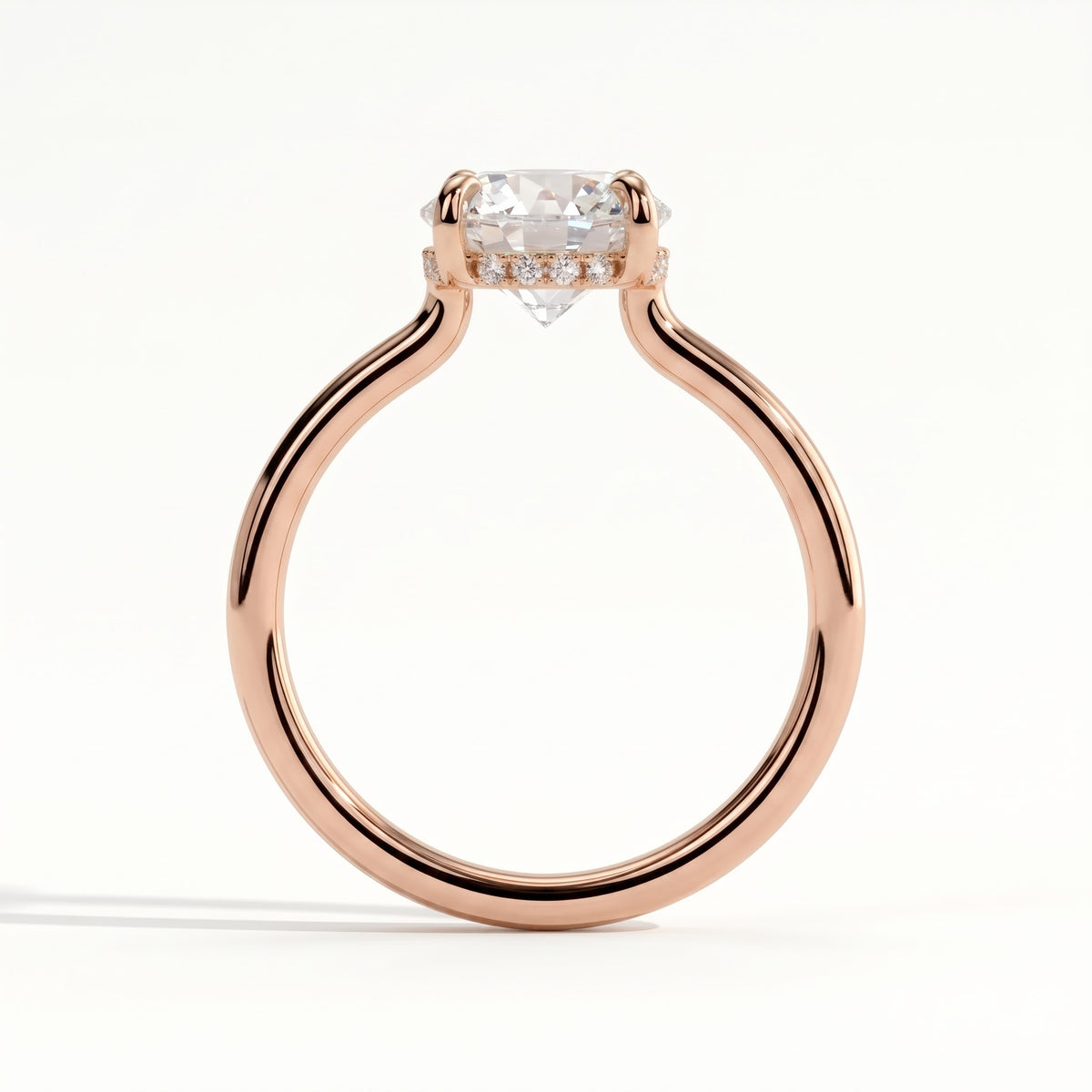 Round lab-grown diamond solitaire engagement ring in 18K (750) rose gold, side profile 