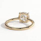 Round lab-grown diamond solitaire engagement ring in 18K (750) yellow gold, on white background 