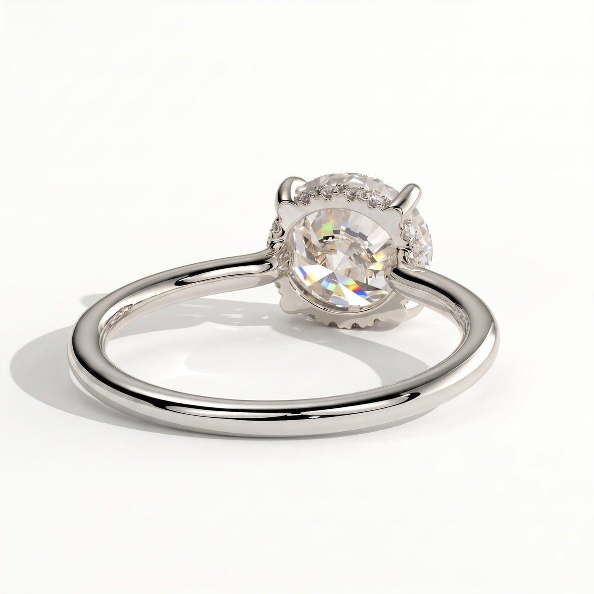 Round lab-grown diamond solitaire engagement ring in 950 platinum, on white background 
