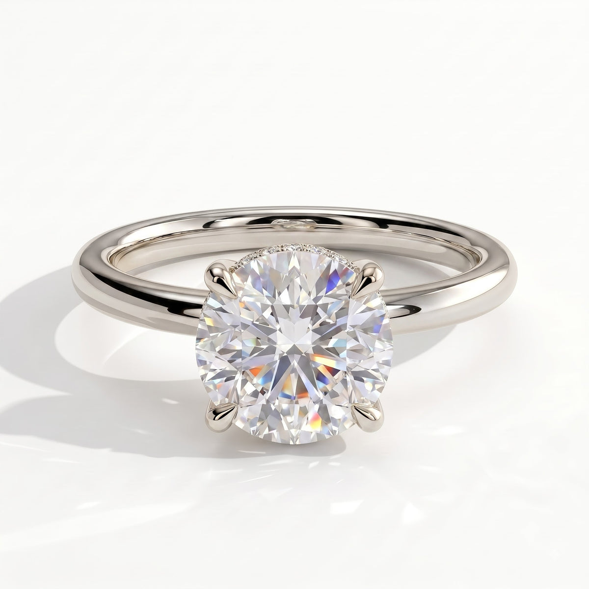 Round lab-grown diamond solitaire engagement ring in 950 platinum, front view 