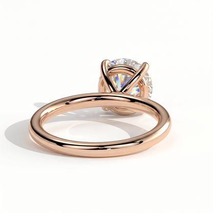 Round lab-grown diamond halo engagement ring in 14K (585) rose gold, on white background 