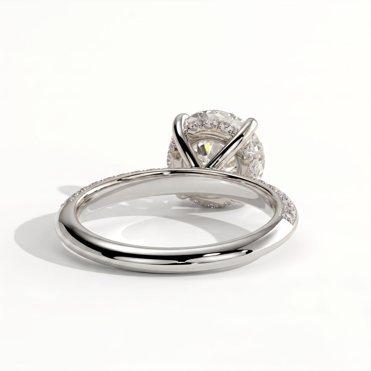 Round lab-grown diamond halo engagement ring in 18K (750) white gold, on white background 