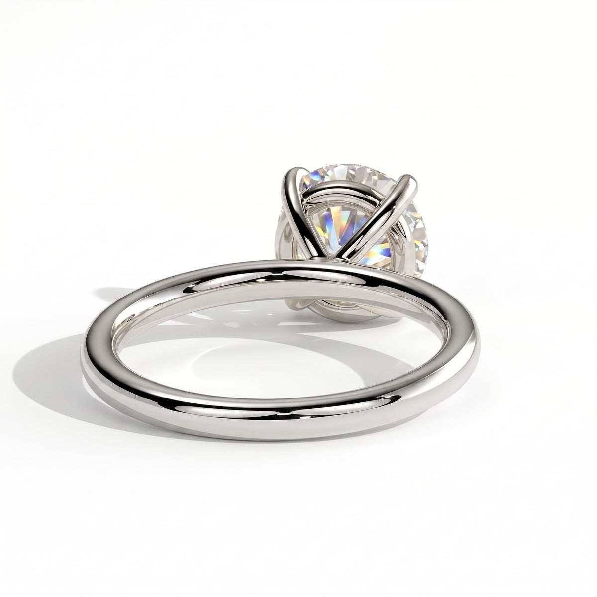 Round lab-grown diamond halo engagement ring in 950 platinum, on white background 