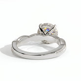 Round lab-grown diamond halo engagement ring in 18K (750) white gold, on white background 