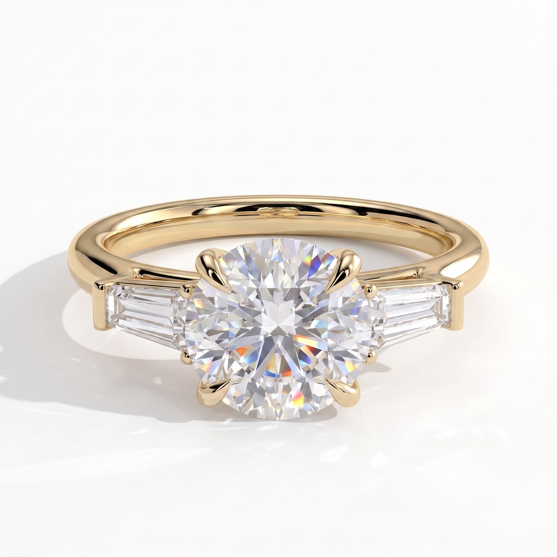 Round lab-grown diamond three-stone engagement ring in 14K (585) yellow gold, front view 