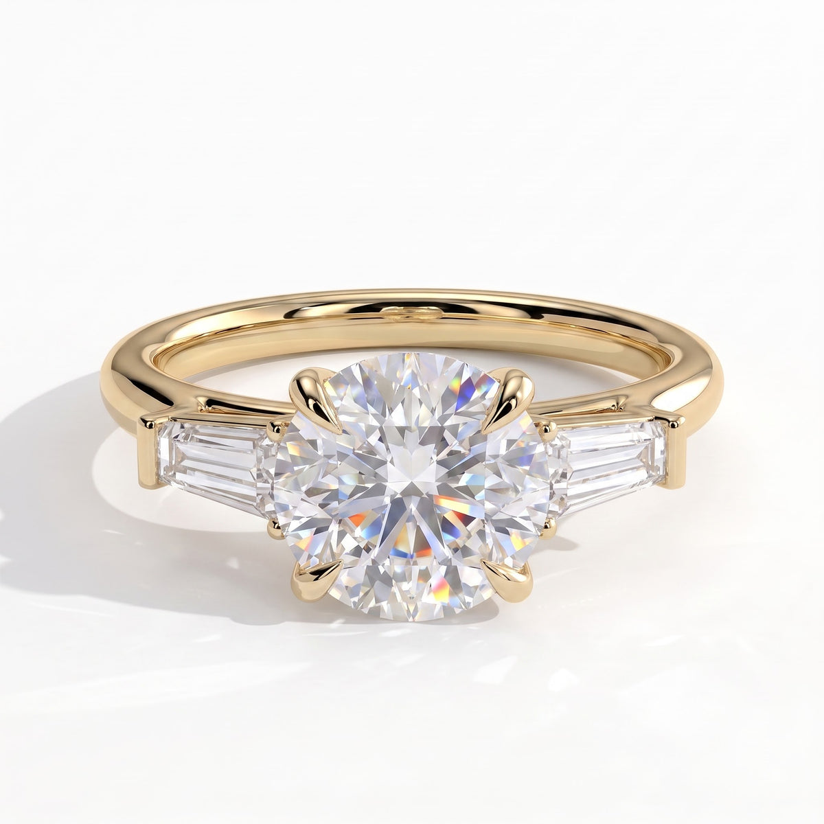 Round lab-grown diamond three-stone engagement ring in 14K (585) yellow gold, front view 
