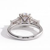 Round lab-grown diamond three-stone engagement ring in 18K (750) white gold, on white background 
