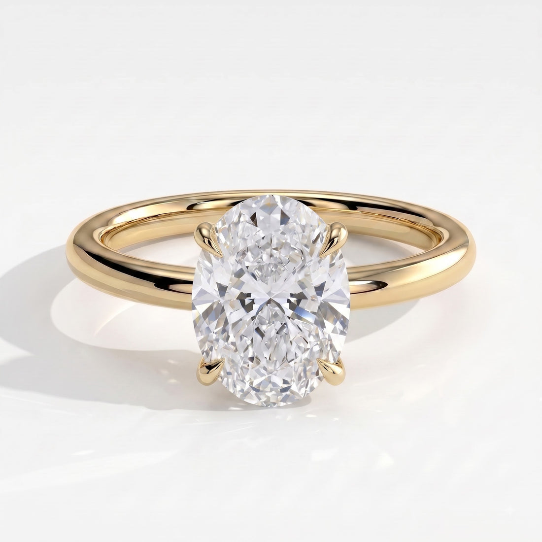 Oval lab-grown diamond solitaire engagement ring in 14K (585) yellow gold, front view 