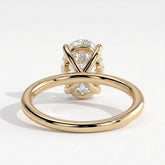 Oval lab-grown diamond solitaire engagement ring in 14K (585) yellow gold, on white background 