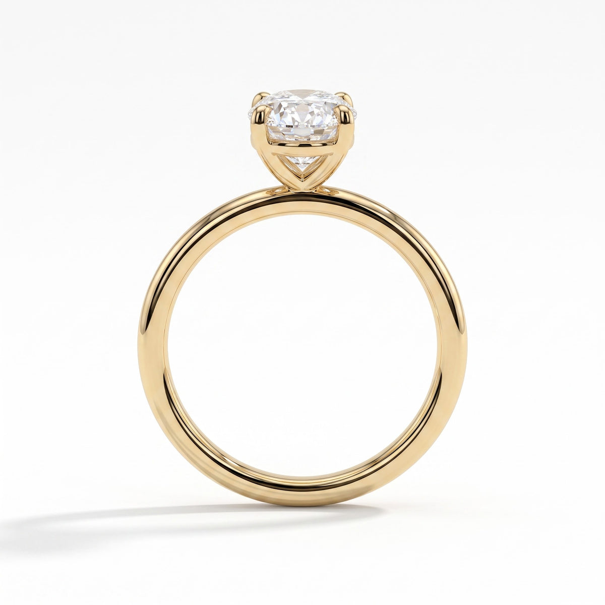 Oval lab-grown diamond solitaire engagement ring in 14K (585) yellow gold, side profile 