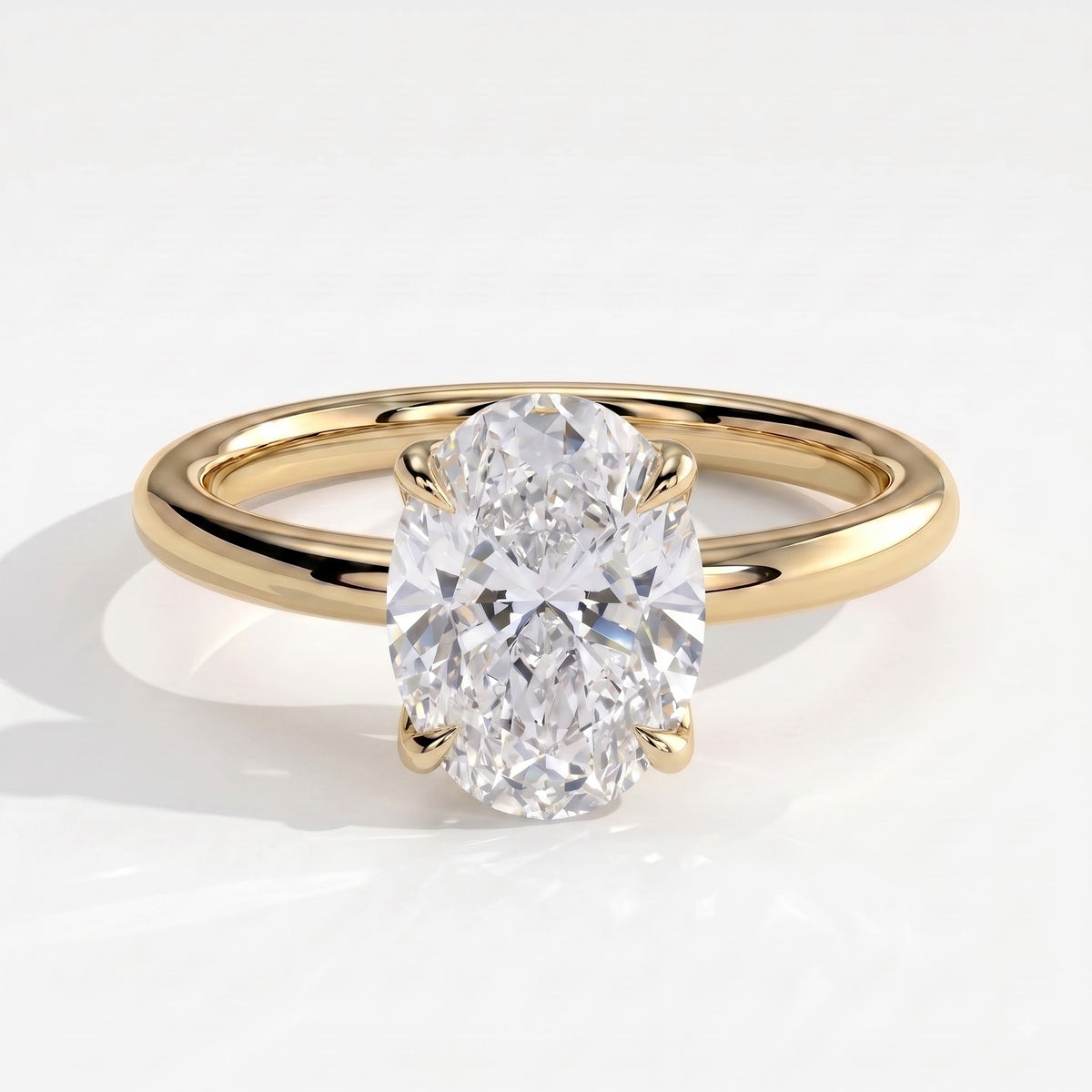 Oval lab-grown diamond solitaire engagement ring in 14K (585) yellow gold, front view 