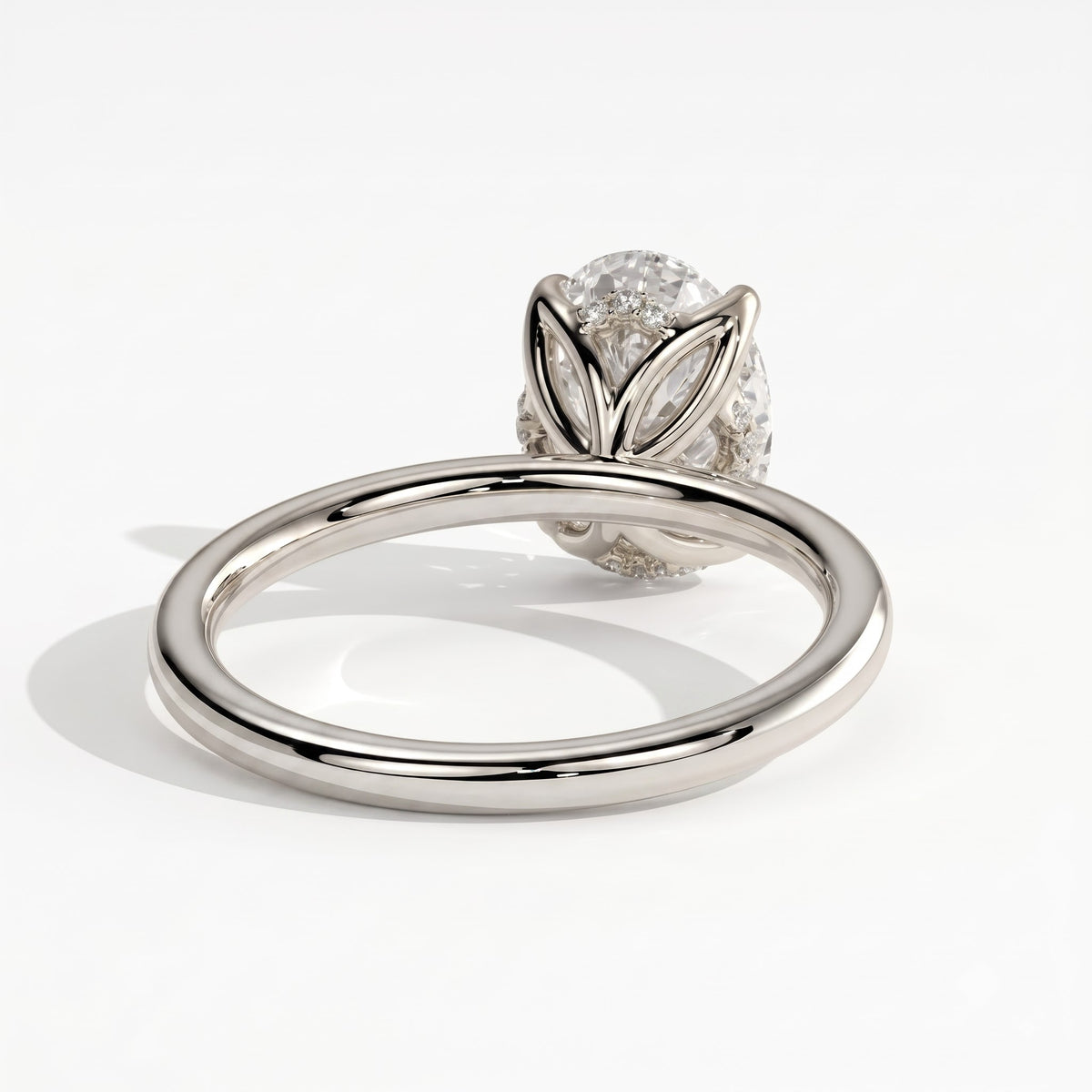Oval lab-grown diamond solitaire engagement ring in 14K (585) white gold, on white background 