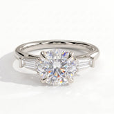 Round lab-grown diamond three-stone engagement ring in 950 platinum, front view 