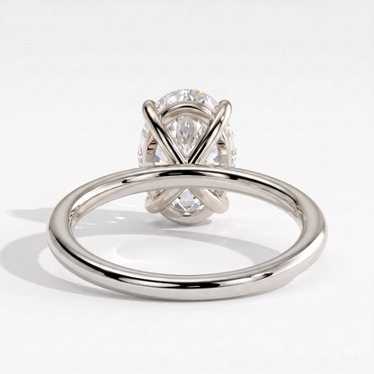 Oval lab-grown diamond solitaire engagement ring in 18K (750) white gold, on white background 