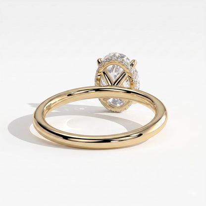 Oval lab-grown diamond solitaire engagement ring in 14K (585) yellow gold, on white background 