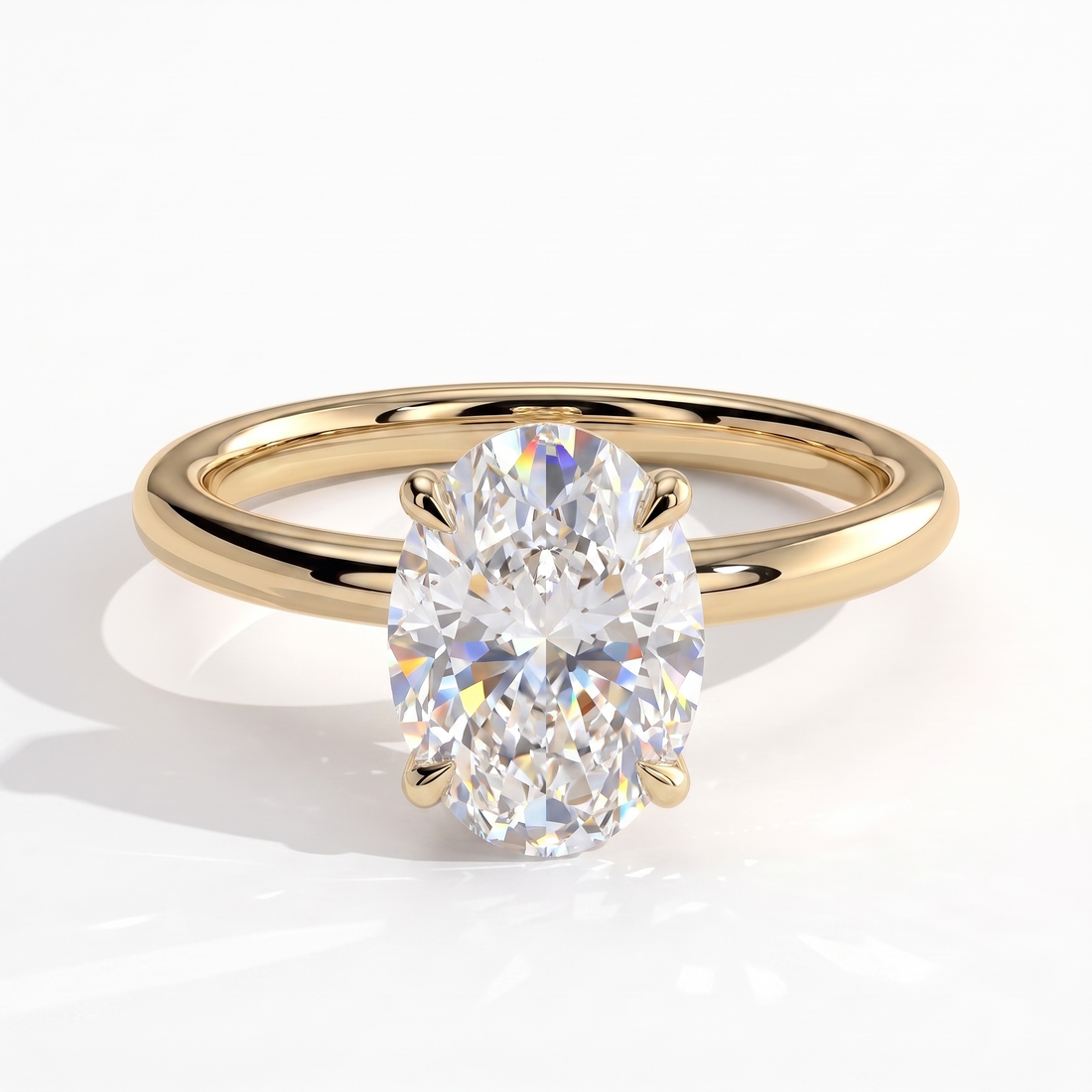 Oval lab-grown diamond solitaire engagement ring in 14K (585) yellow gold, front view 