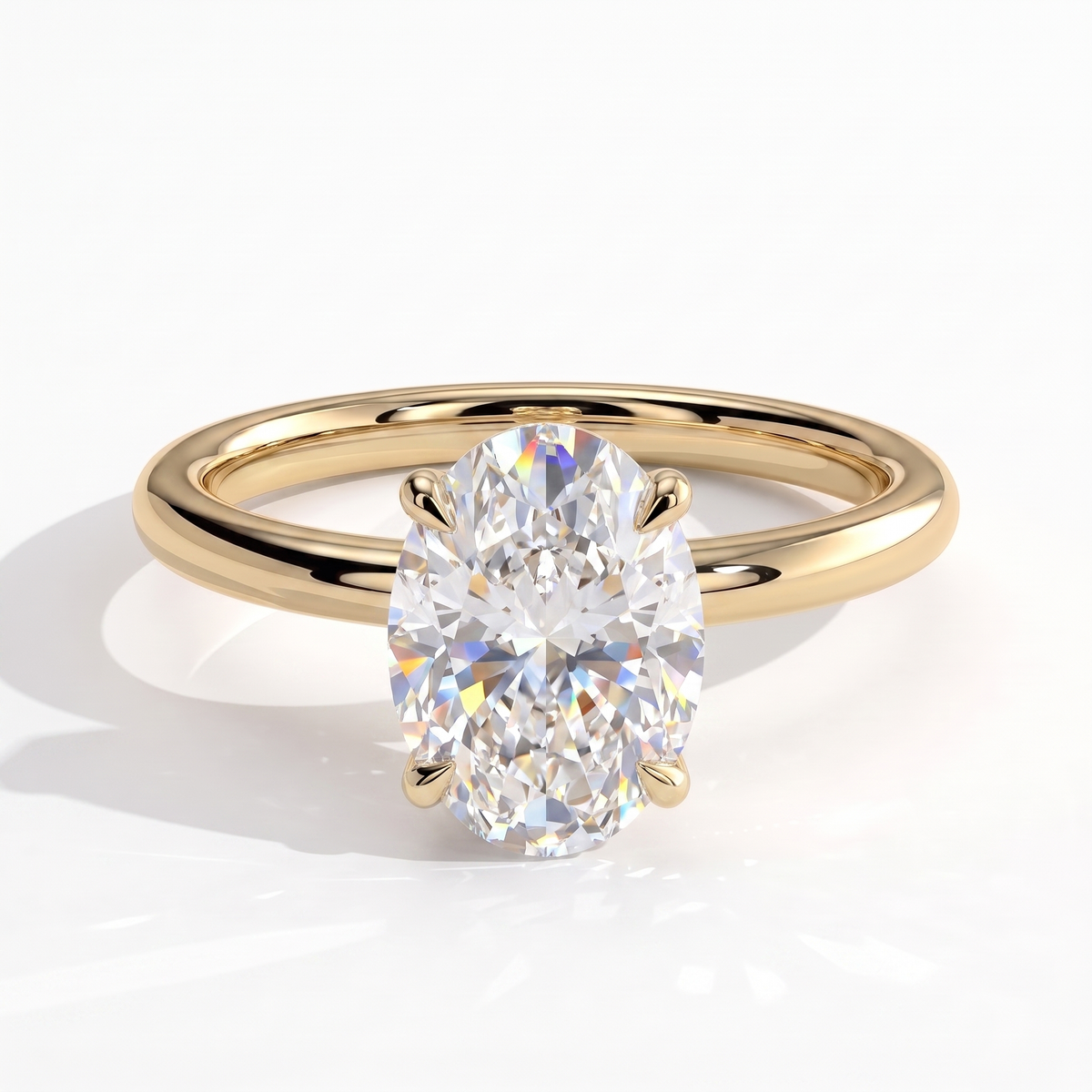 Oval lab-grown diamond solitaire engagement ring in 14K (585) yellow gold, front view 