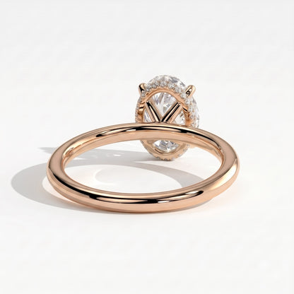 Oval lab-grown diamond solitaire engagement ring in 18K (750) rose gold, on white background 