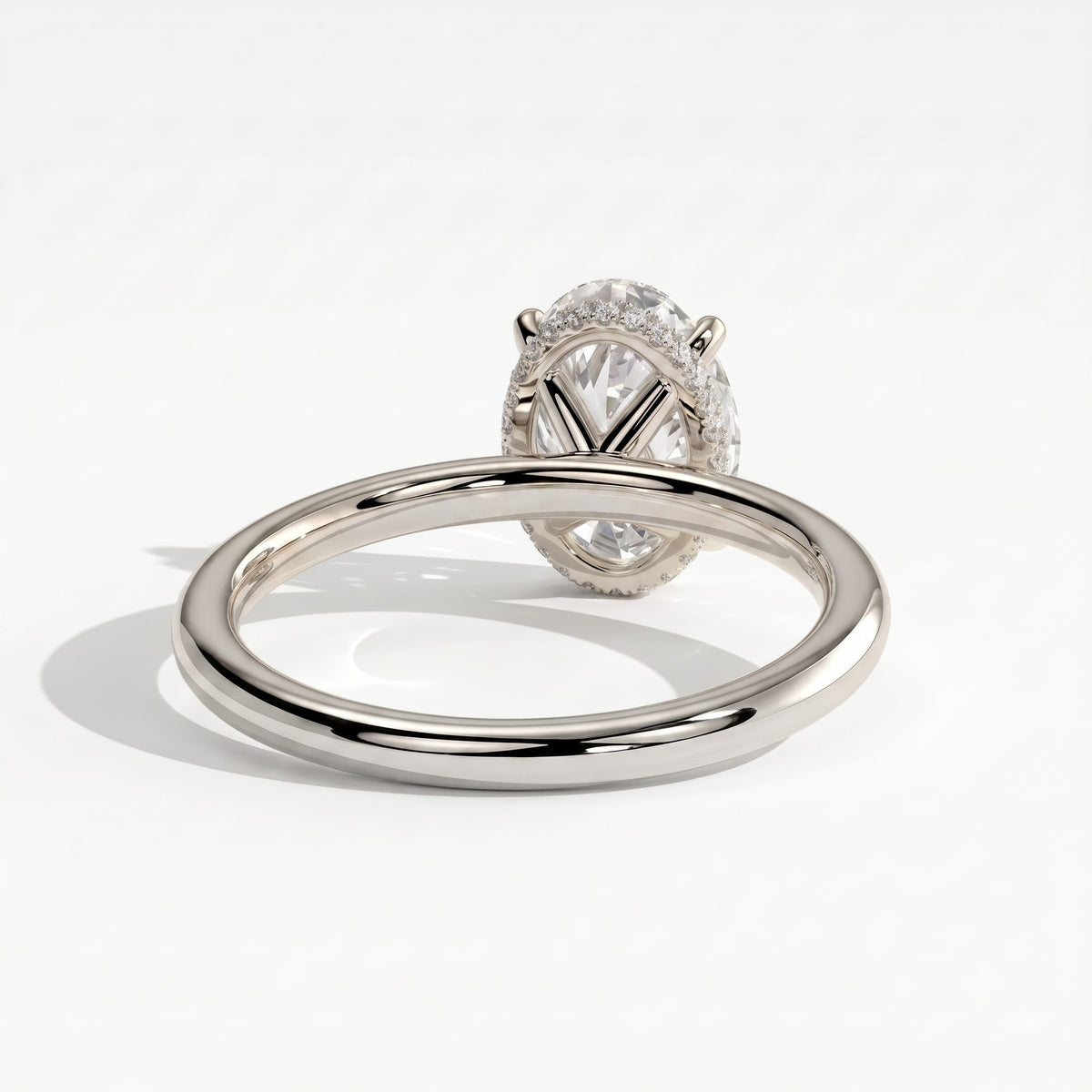 Oval lab-grown diamond solitaire engagement ring in 18K (750) white gold, on white background 