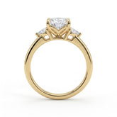 Oval lab-grown diamond three-stone engagement ring in 18K (750) yellow gold, side profile 