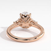 Oval lab-grown diamond three-stone engagement ring in 18K (750) rose gold, on white background 