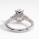 Oval lab-grown diamond three-stone engagement ring in 950 platinum, on white background 