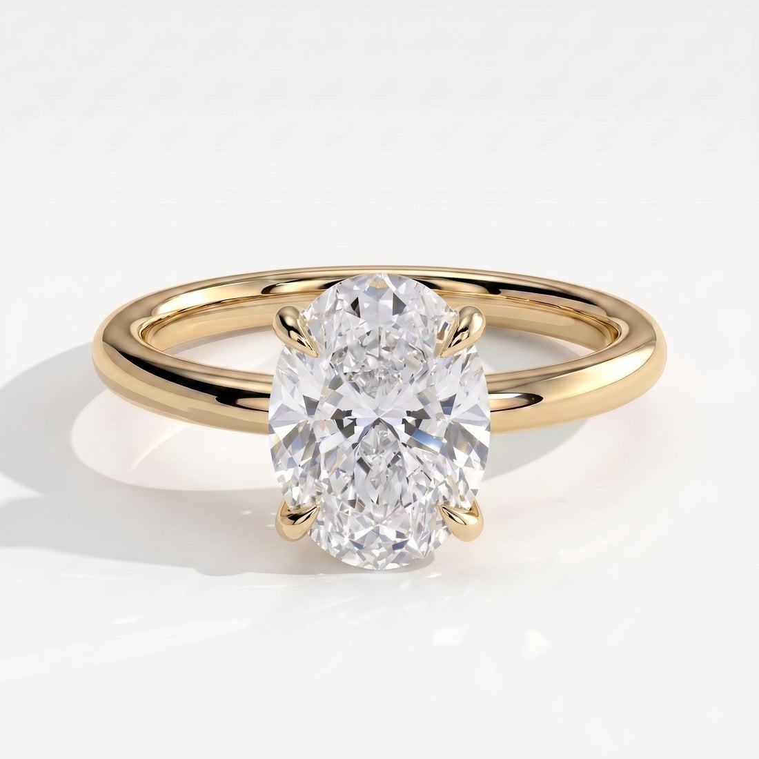 Oval lab-grown diamond solitaire engagement ring in 14K (585) yellow gold, front view 