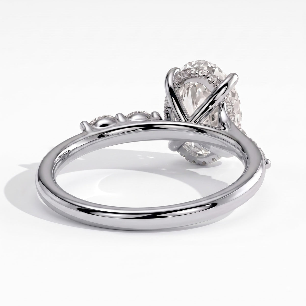 Oval lab-grown diamond halo engagement ring in 14K (585) white gold, on white background 