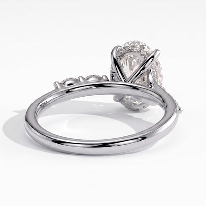 Oval lab-grown diamond halo engagement ring in 950 platinum, on white background 