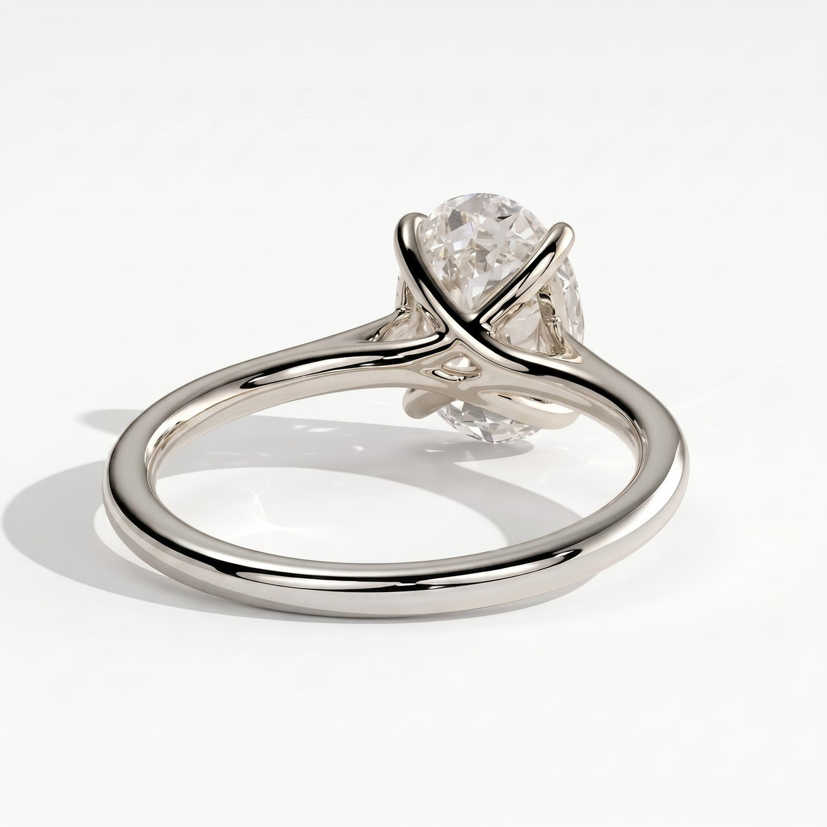 Oval lab-grown diamond solitaire engagement ring in 14K (585) white gold, on white background 