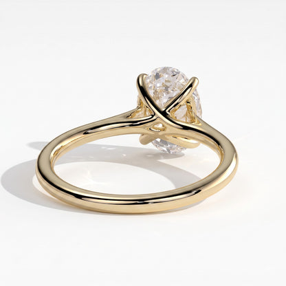 Oval lab-grown diamond solitaire engagement ring in 14K (585) yellow gold, on white background 
