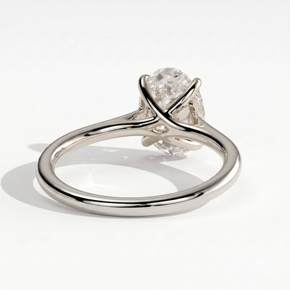 Oval lab-grown diamond solitaire engagement ring in 18K (750) white gold, on white background 